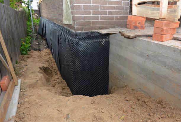 SJ Waterproofing Pros technician performing targeted Waterproofing assessment in Byron, MI